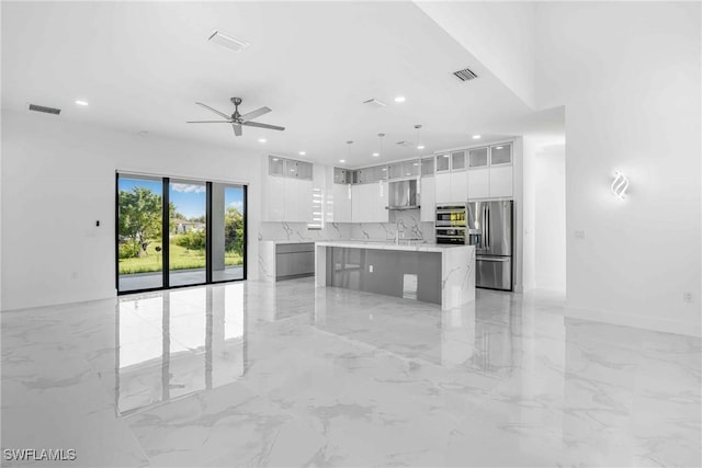 kitchen featuring ventilation hood, a spacious island, pendant lighting, stainless steel fridge with ice dispenser, and white cabinetry