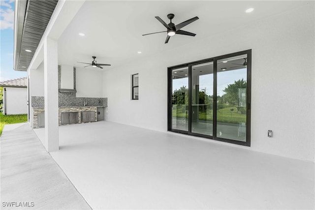 view of patio / terrace featuring ceiling fan