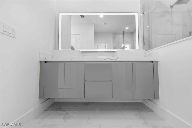 bathroom with vanity and walk in shower