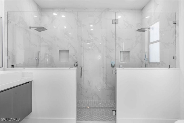 bathroom featuring vanity and walk in shower