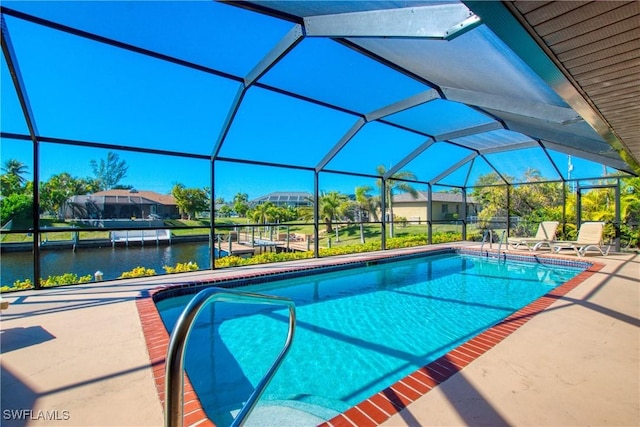 view of swimming pool with a water view, a patio, and glass enclosure