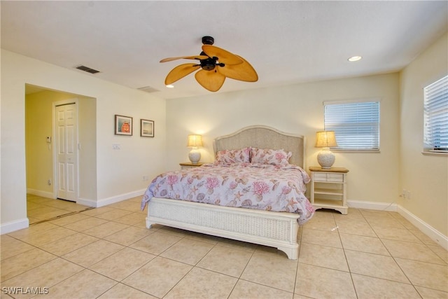 tiled bedroom with ceiling fan