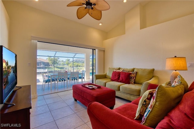 living room featuring light tile patterned floors, high vaulted ceiling, and ceiling fan