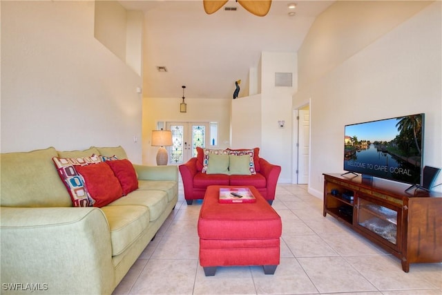 living room featuring french doors, ceiling fan, high vaulted ceiling, and light tile patterned floors