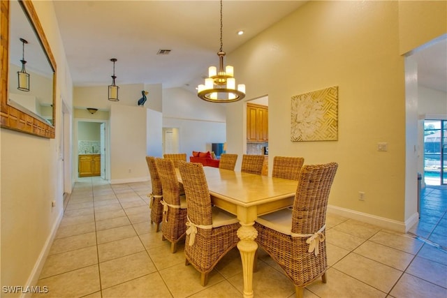 dining space with light tile patterned flooring, high vaulted ceiling, and a notable chandelier