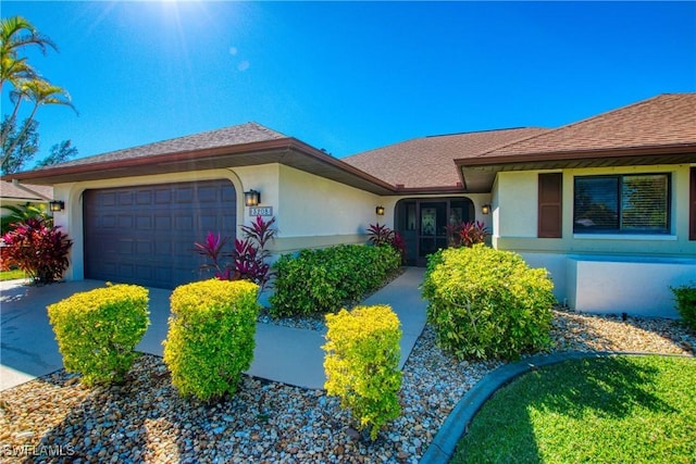 ranch-style house featuring a garage