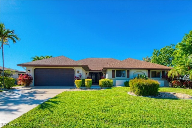 single story home featuring a garage and a front yard