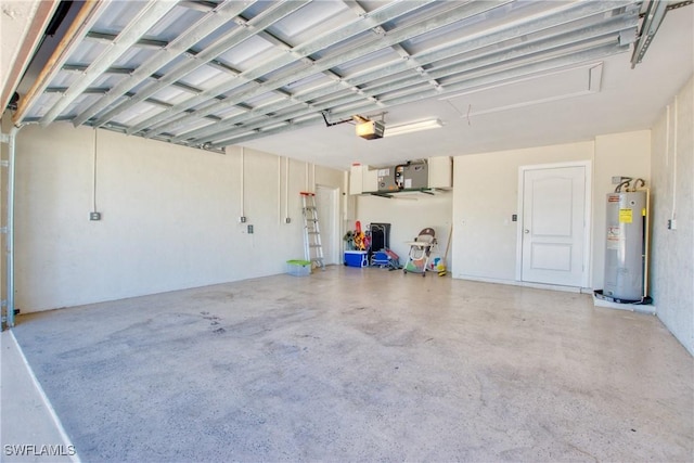 garage featuring a garage door opener and water heater