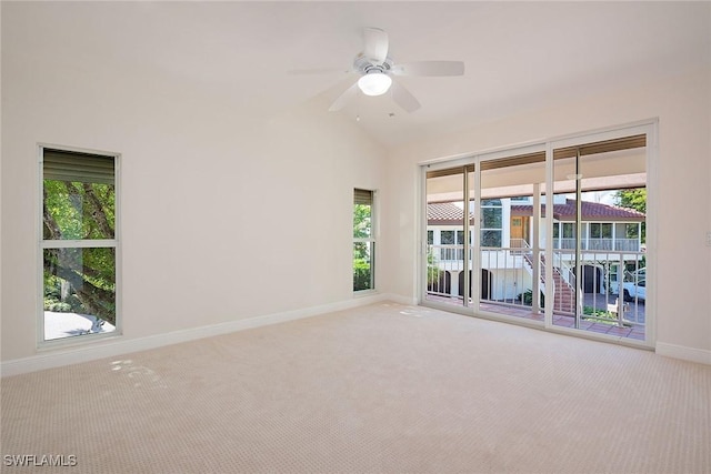 unfurnished room featuring light carpet, high vaulted ceiling, and ceiling fan