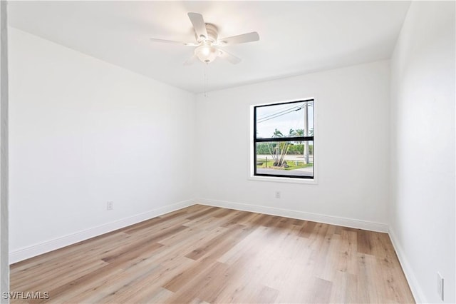 unfurnished room featuring ceiling fan and light wood-type flooring