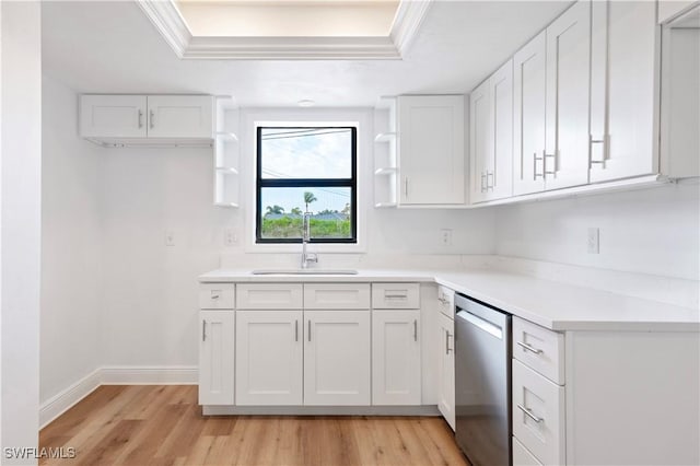 kitchen with dishwasher, white cabinets, sink, crown molding, and light hardwood / wood-style flooring