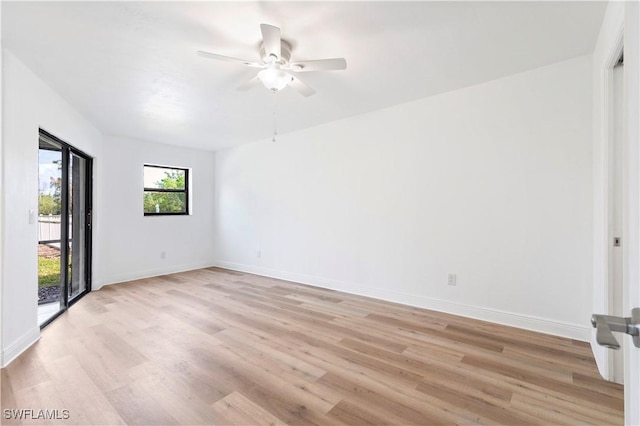 empty room featuring light hardwood / wood-style flooring and ceiling fan