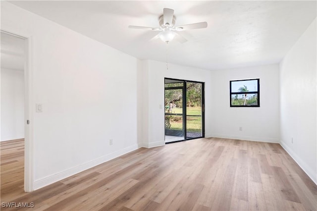 spare room with ceiling fan and light hardwood / wood-style flooring