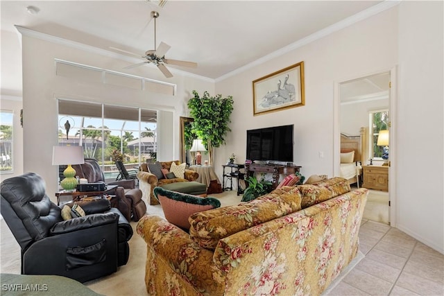 tiled living room featuring plenty of natural light, ornamental molding, and ceiling fan