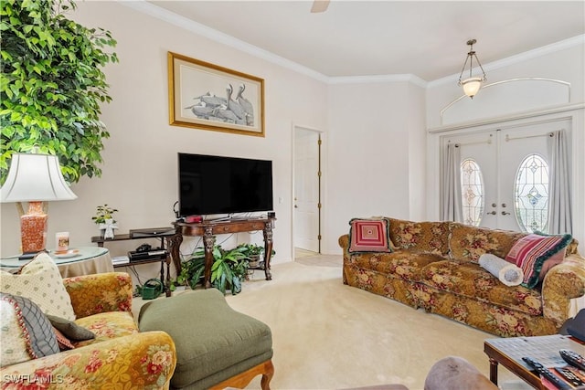 carpeted living room with ornamental molding and french doors