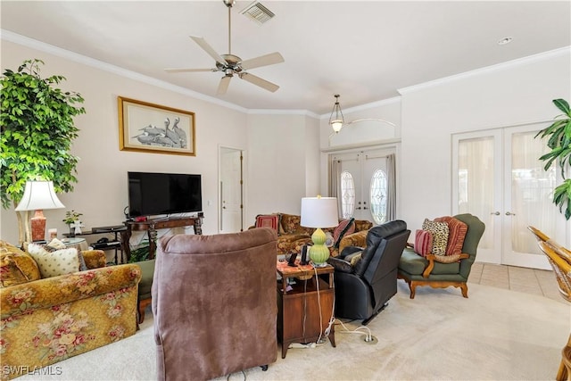 living room with light carpet, french doors, ceiling fan, and crown molding