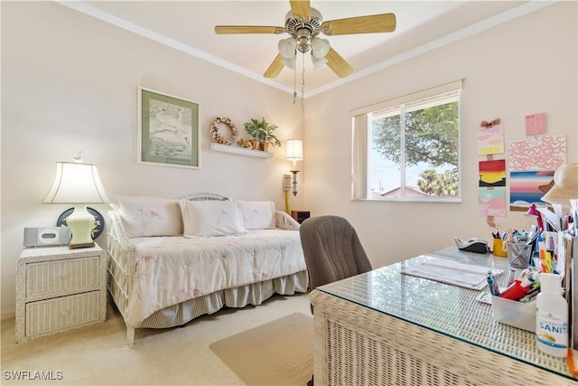 carpeted bedroom with ceiling fan and crown molding