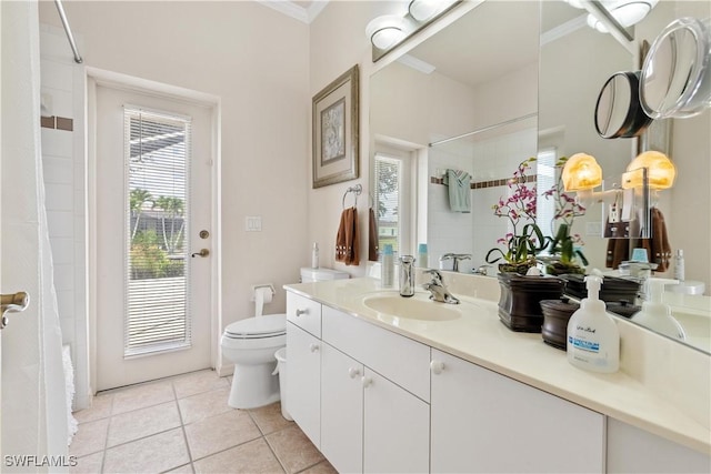 bathroom featuring tile patterned floors, curtained shower, vanity, and toilet