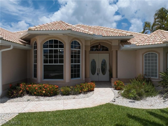 view of exterior entry with french doors