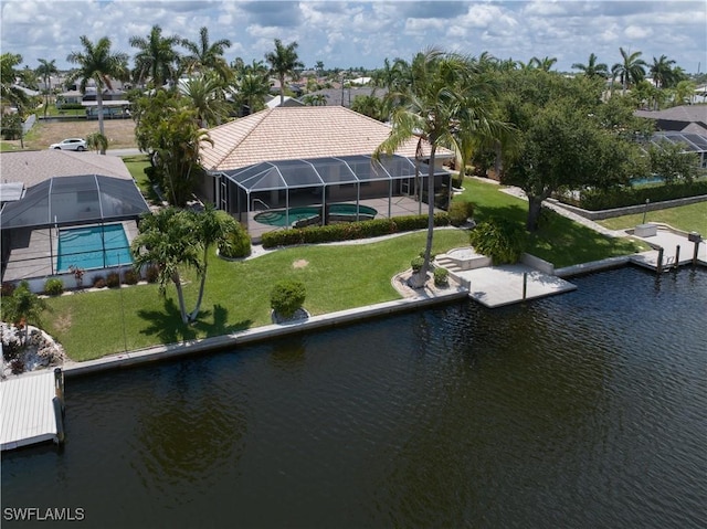 birds eye view of property with a water view