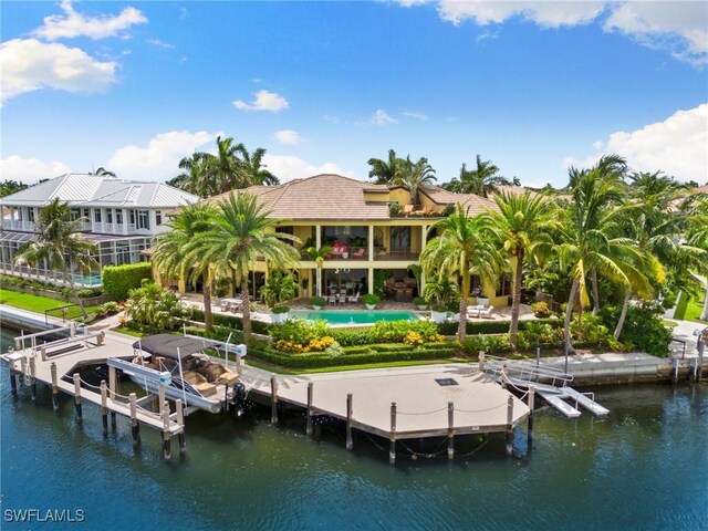 view of dock featuring a balcony, a water view, and a swimming pool