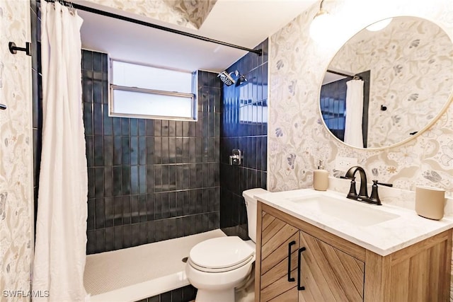 bathroom with curtained shower, vanity, and toilet