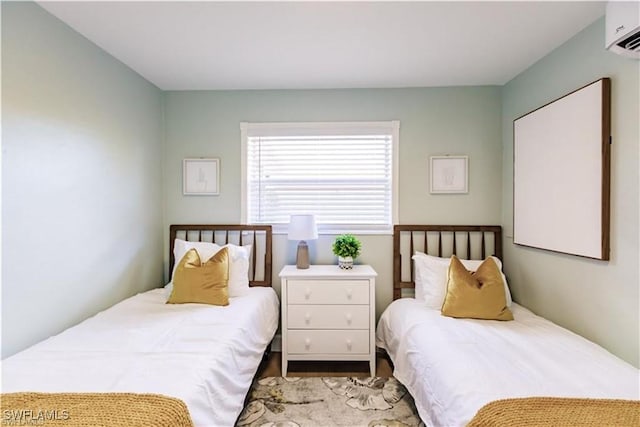 bedroom featuring a wall mounted AC