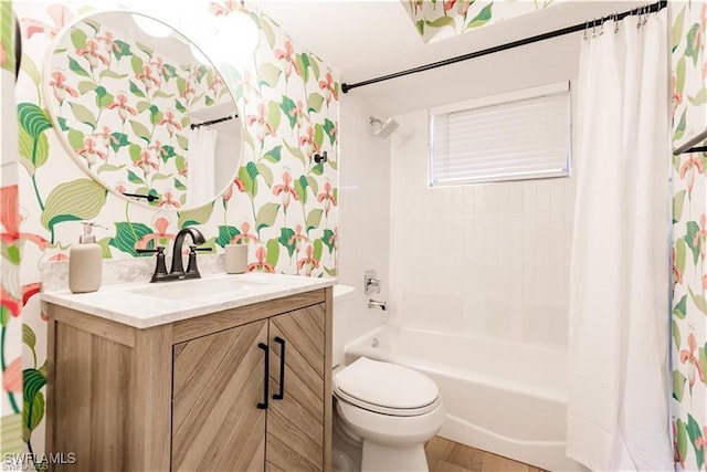 full bathroom featuring vanity, shower / tub combo, and toilet