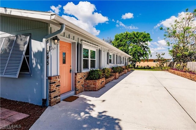 view of side of home featuring a patio