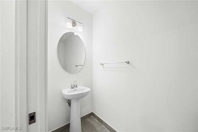 bathroom with tile patterned flooring and sink