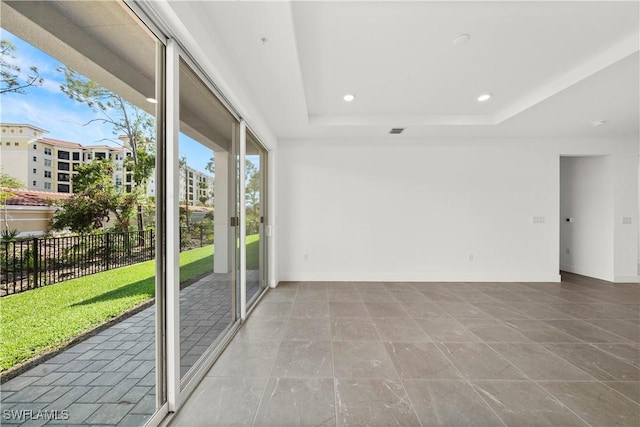 interior space featuring a tray ceiling