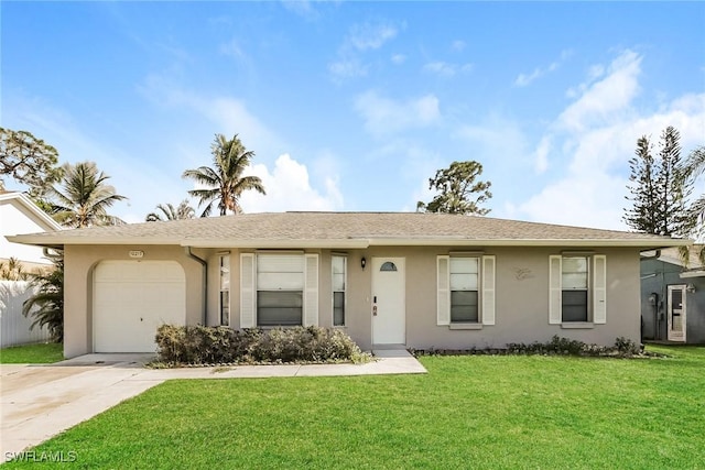 ranch-style home with an attached garage, a front yard, and stucco siding