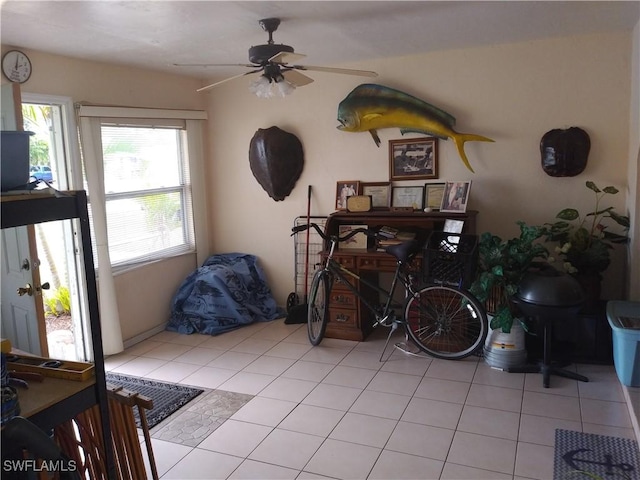 living room with light tile patterned floors and ceiling fan