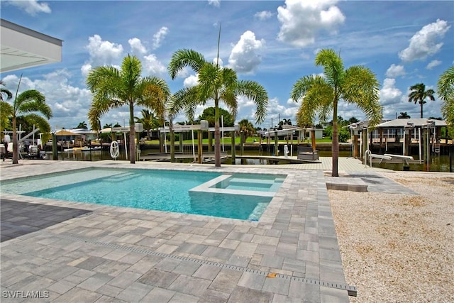 view of pool with a boat dock and a water view