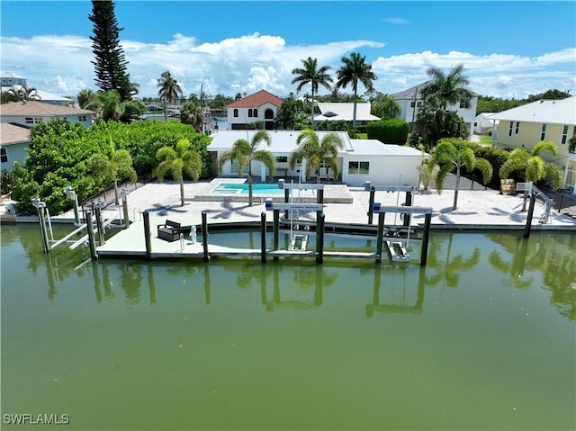 dock area featuring a patio area and a water view