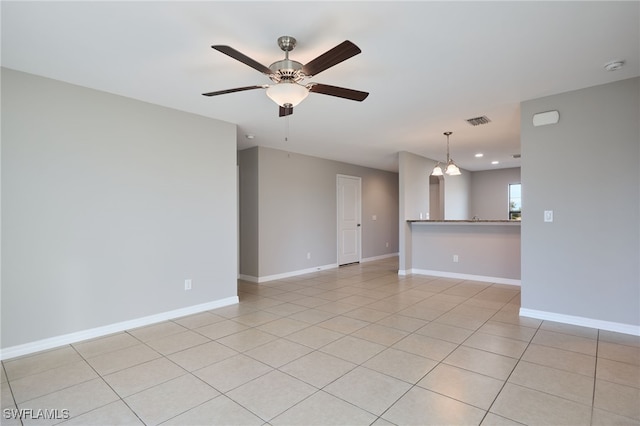 tiled empty room with ceiling fan