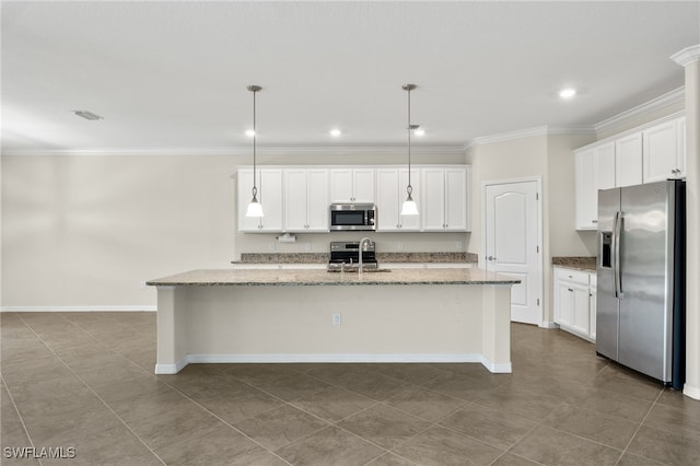 kitchen featuring a center island with sink, decorative light fixtures, white cabinetry, and stainless steel appliances