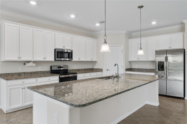 kitchen with white cabinetry, a kitchen island with sink, and appliances with stainless steel finishes