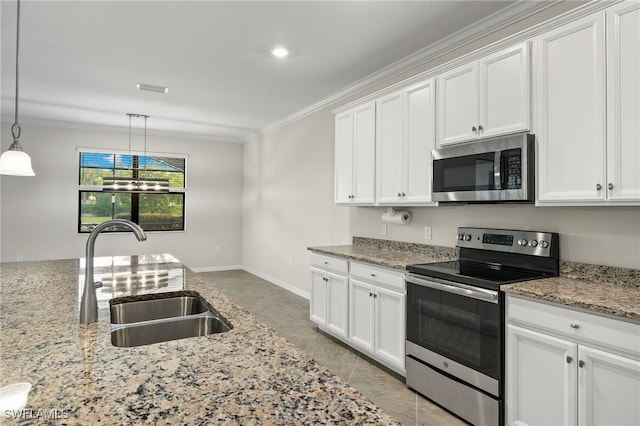 kitchen featuring white cabinetry, sink, stainless steel appliances, light stone counters, and decorative light fixtures