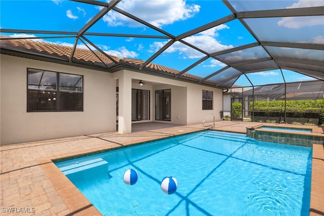 view of pool featuring ceiling fan, a lanai, an in ground hot tub, and a patio