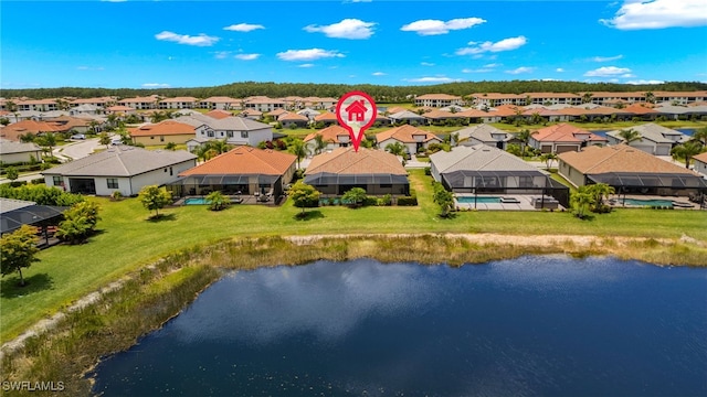 birds eye view of property with a water view