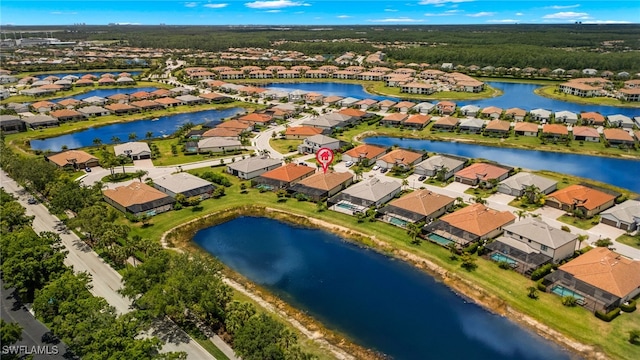 birds eye view of property with a water view