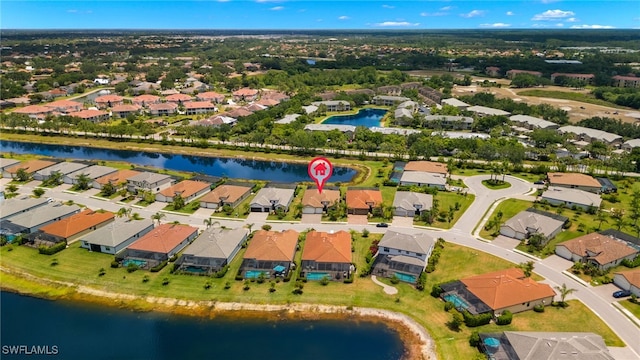 drone / aerial view with a water view