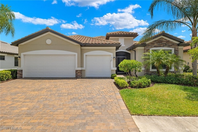 mediterranean / spanish-style home with a garage