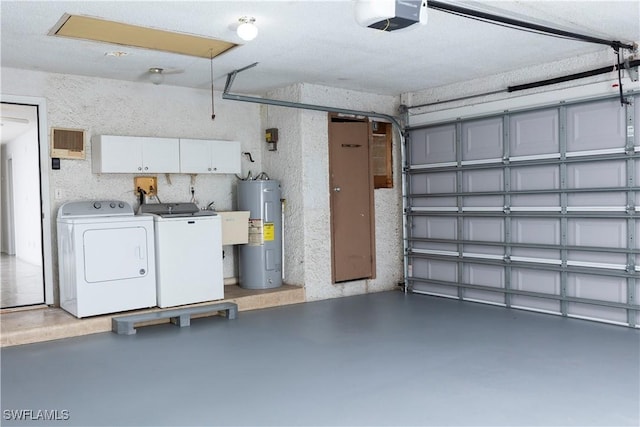 garage with washer and clothes dryer, water heater, and a garage door opener