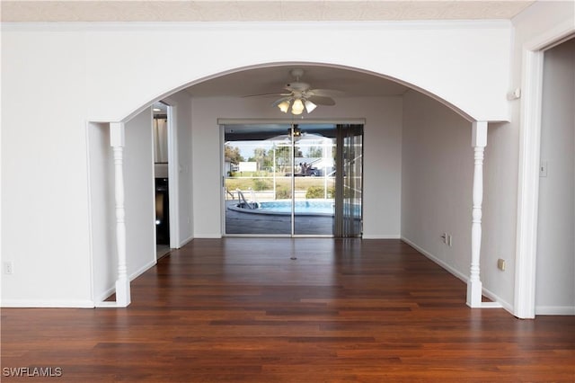 unfurnished dining area featuring ceiling fan, dark hardwood / wood-style floors, and ornamental molding