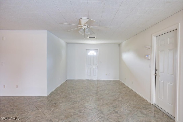 unfurnished room with ceiling fan