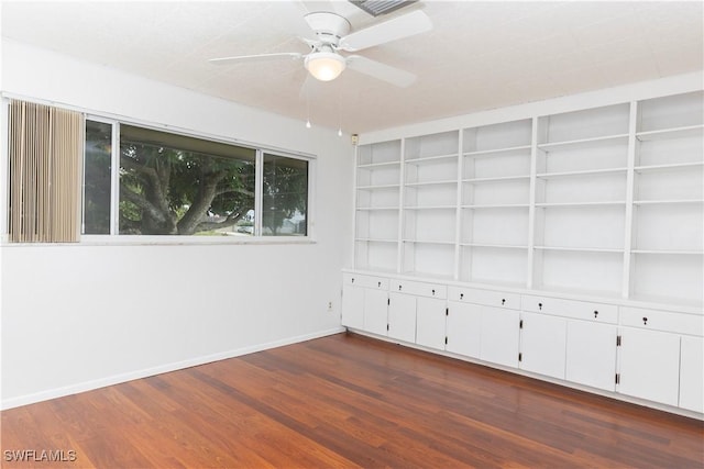 unfurnished room featuring ceiling fan and dark hardwood / wood-style floors