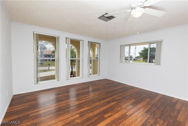 unfurnished room with ceiling fan, crown molding, and dark hardwood / wood-style floors