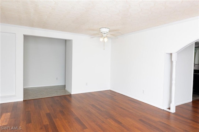 empty room featuring a textured ceiling, ceiling fan, crown molding, and dark hardwood / wood-style floors